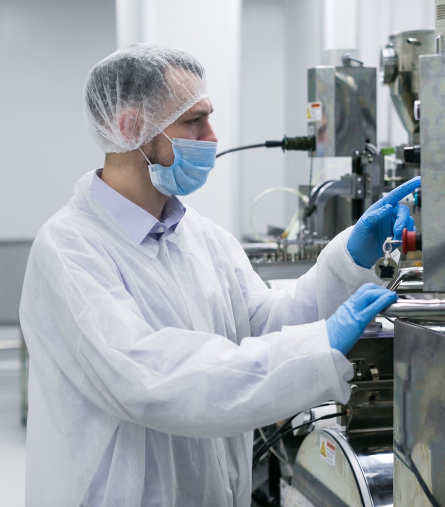 worker-factory-white-suit-working-with-manufacture-machine